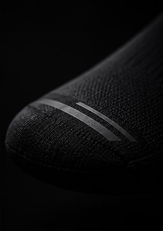 Puntera sin costuras de la PACE Performance Sock con banda reflectiva.